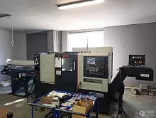 Токaрнo-фрeзeрный станок SMEC SL2000AM с устройством подачи прутка Fedek DH65L-S2